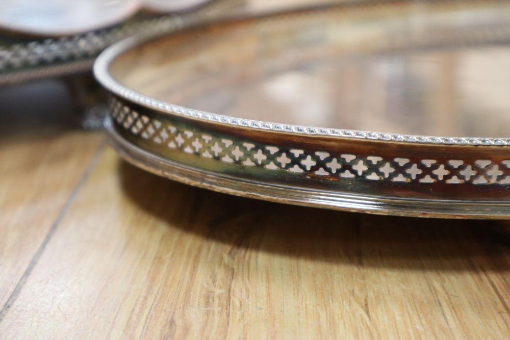 An oval two handled plated tray on lion paw feet, and another tray, largest 57cm
